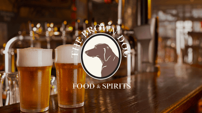 The Brown Dog Food & Spirits logo