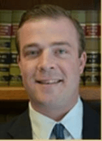 The Law Office of John R. Kominski, Jr., LLC logo